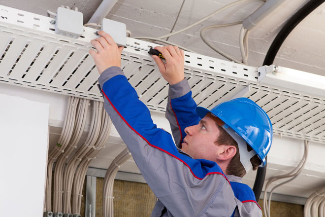 An electrician installs low current electrical systems. 