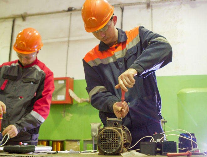 Electrician performs the inspection of the electric motor. 