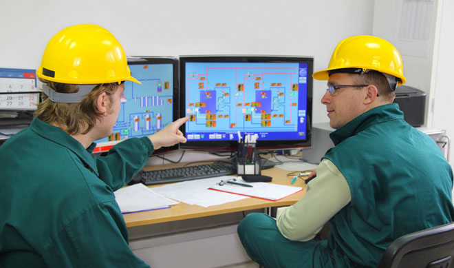 Electrical engineer monitors network parameters. 